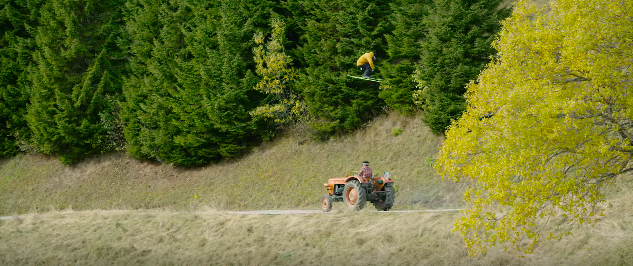 A man riding a bike down a dirt road