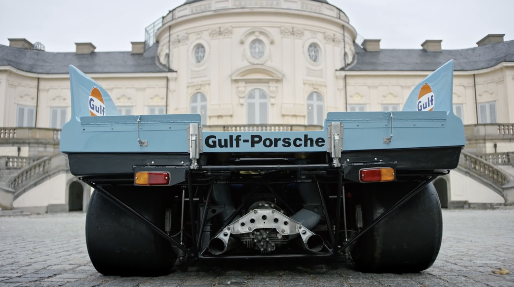 A truck is parked in front of a building