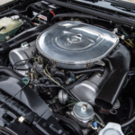 A motorcycle parked on the side of the engine of a car