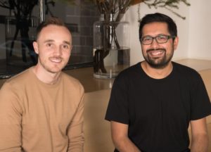 A couple of people posing for the camera