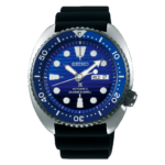 A large blue clock sitting on top of a watch
