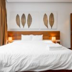 A made bed in a hotel room