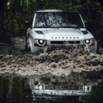 A car driving down a dirt road