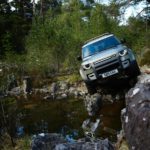 A truck driving down a dirt road