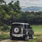 A car driving down a dirt road