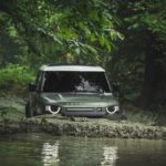 A car parked on the side of a river