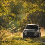 A truck driving down a dirt road
