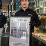 A person standing in front of a store