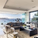 A living room filled with furniture and a large window