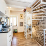 A kitchen with a dining room table