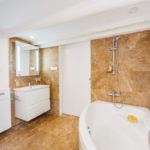 A kitchen with a sink and a bath tub