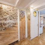 A kitchen with a wood floor