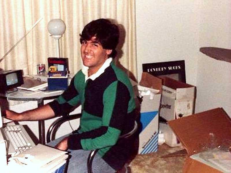 A person sitting at a desk in front of a computer