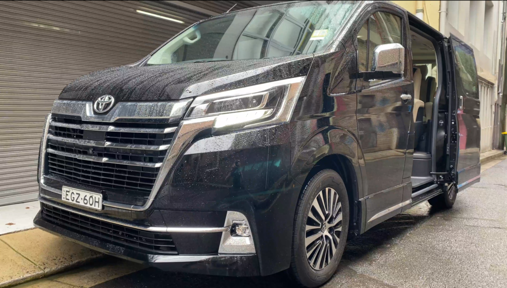 A car parked in front of a truck