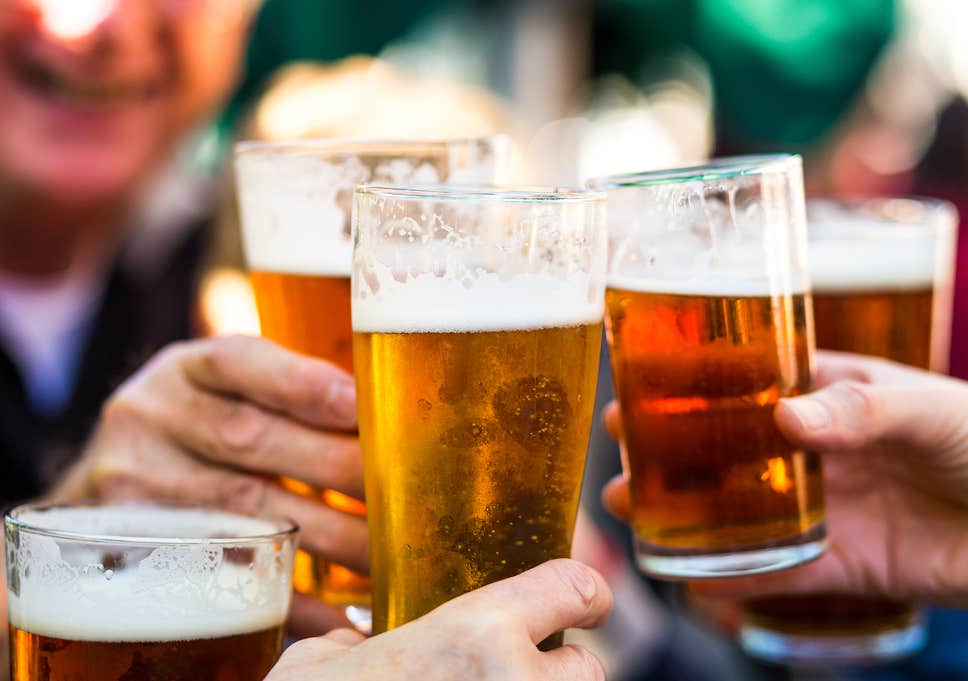 A close up of a person drinking from a glass