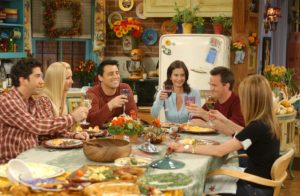 A group of people sitting at a table eating food
