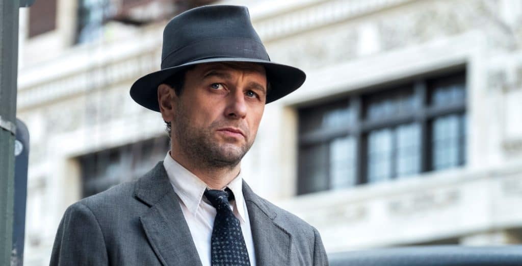 A man wearing a suit and tie