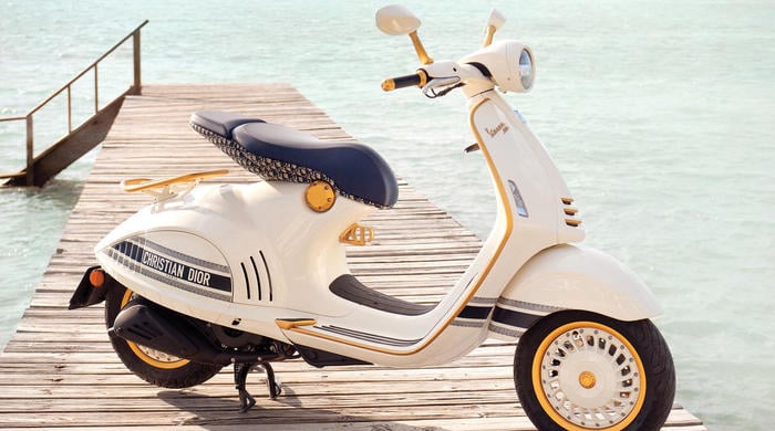 A motorcycle is parked on the beach