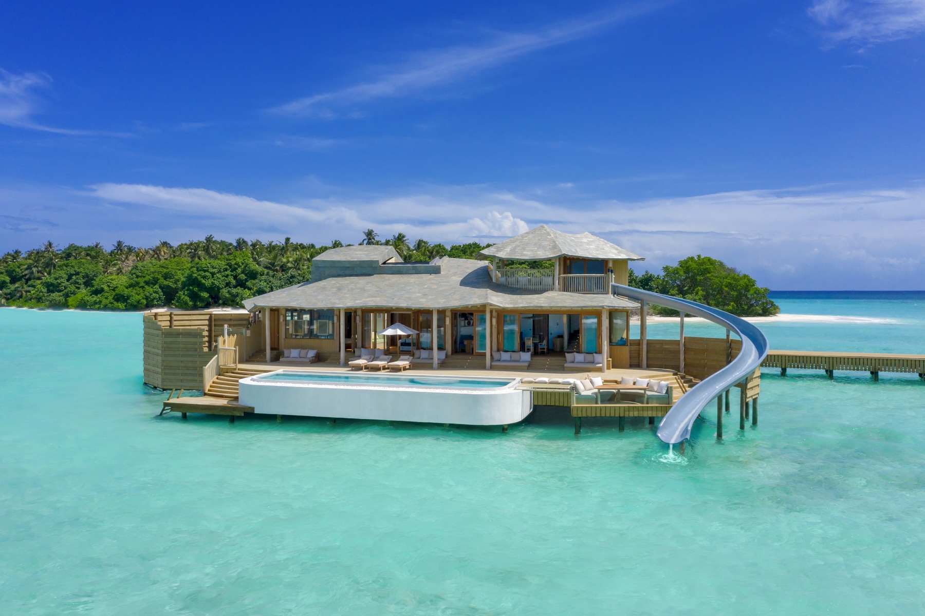 Soneva Fushi Resort Will Have Overwater Villas With A Built-In Water Slide