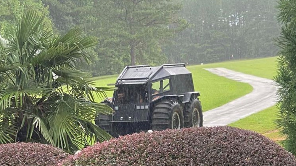 A truck driving down a dirt road