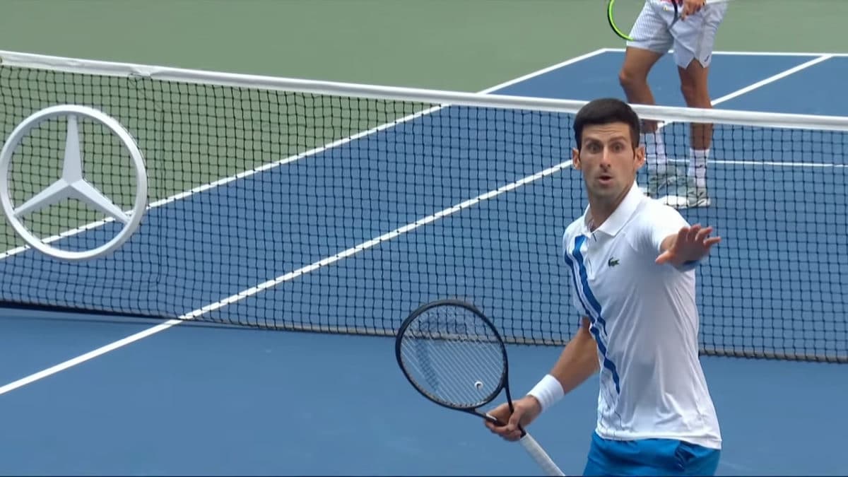 A person on a court with a racket