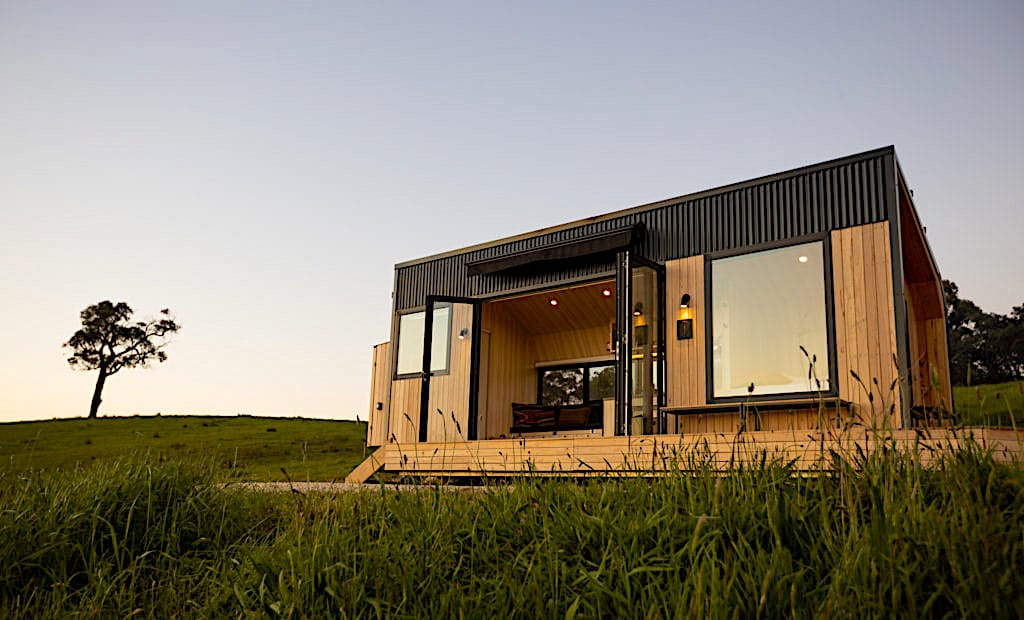 A building with a grassy field