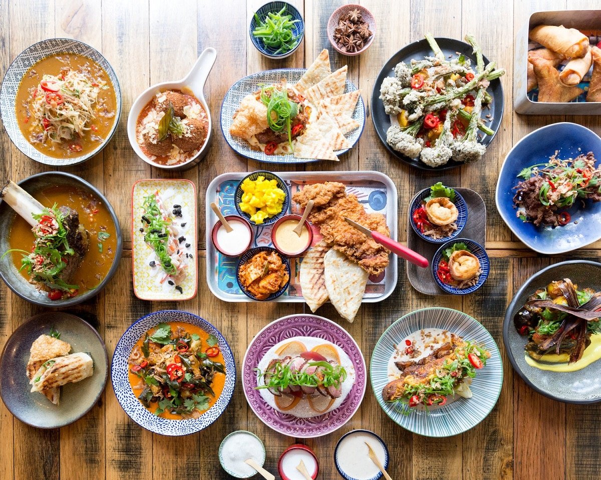 A bunch of different types of food on a wooden table