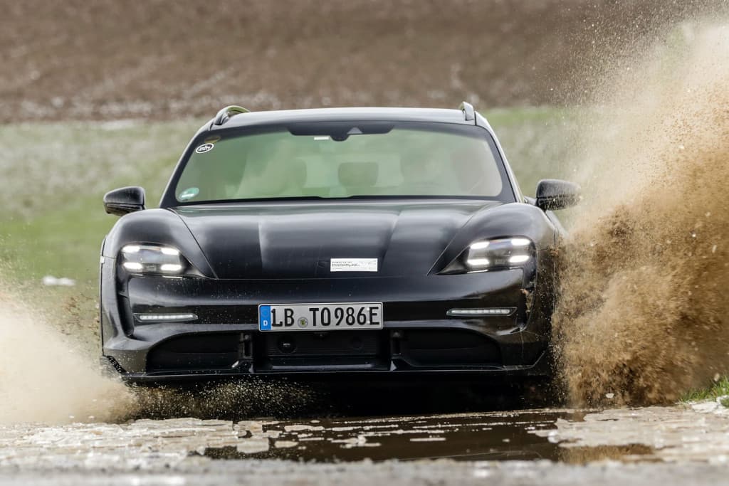 A car driving down a dirt road