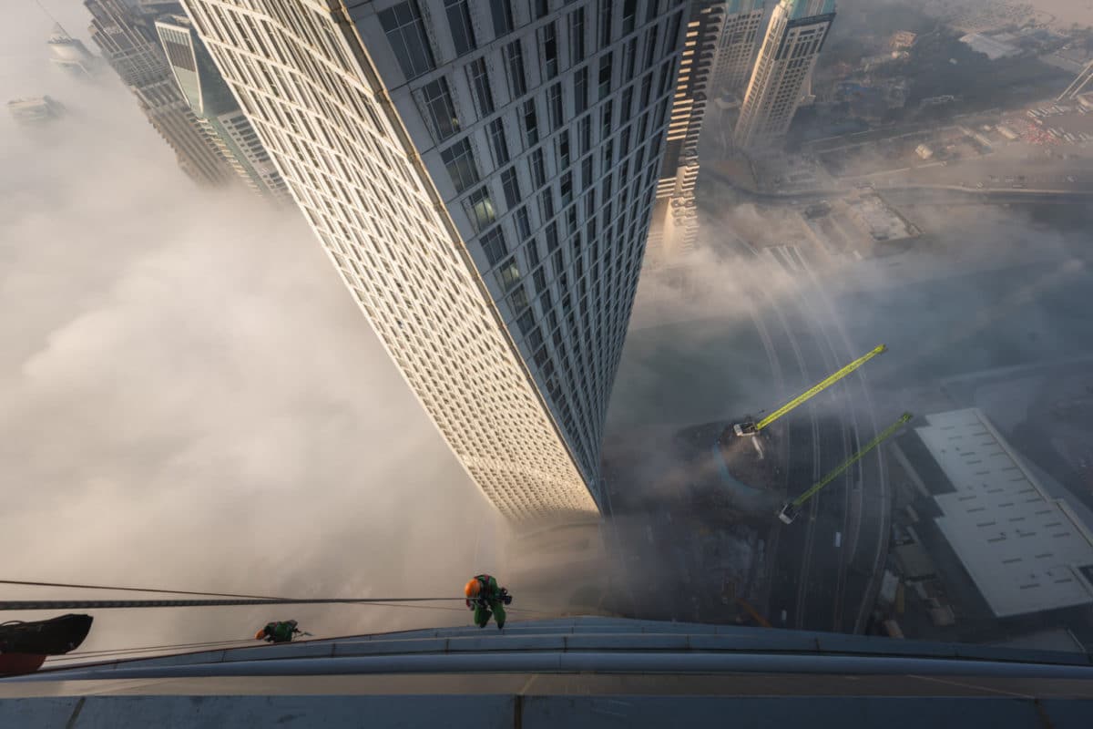 Dubai window cleaners scaling one of the tallest towers in the city.