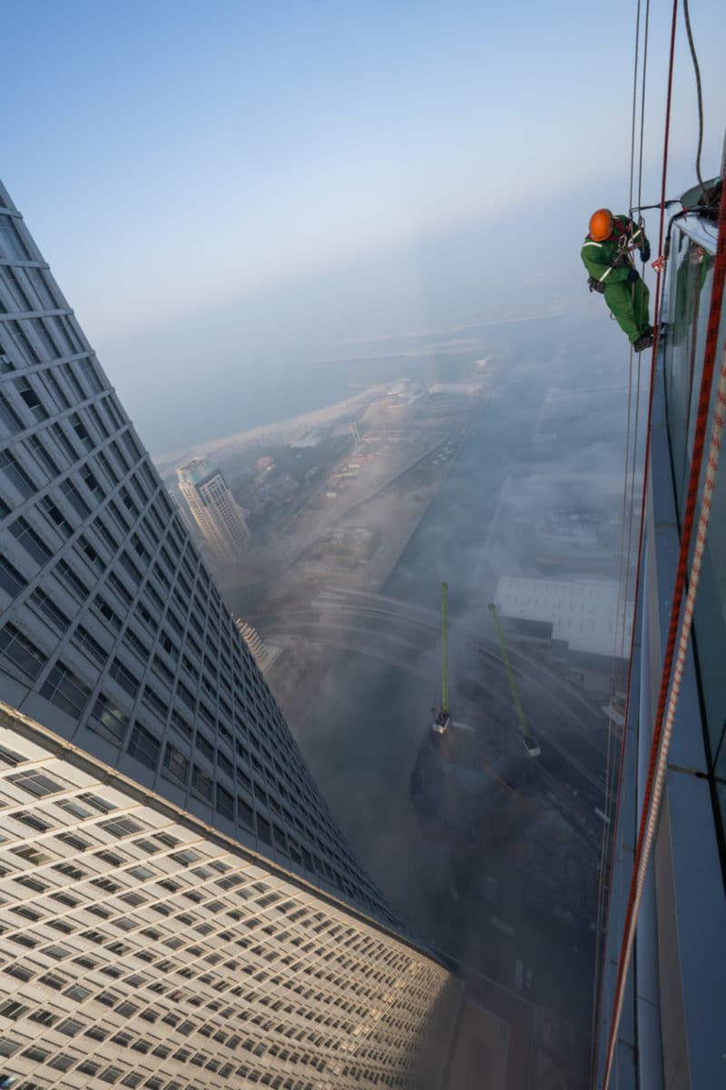Albert Dros took these photos of Dubai window cleaners on a foggy day.