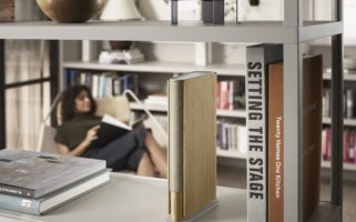 Beosound Emerge sitting on a bookshelf
