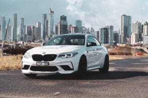 A car driving on a road in a city