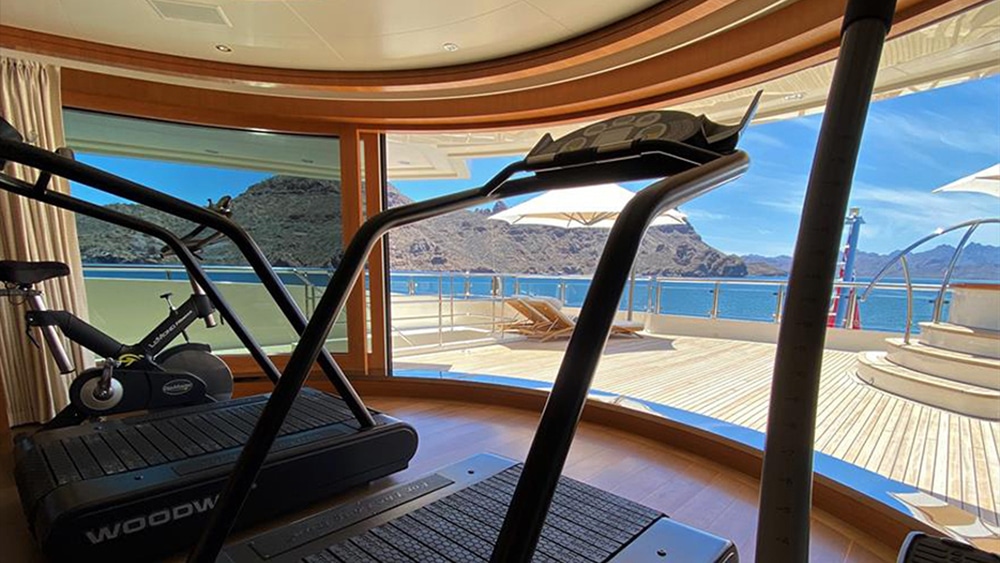Exercise room looking out to the deck of Steven Spielberg's superyacht