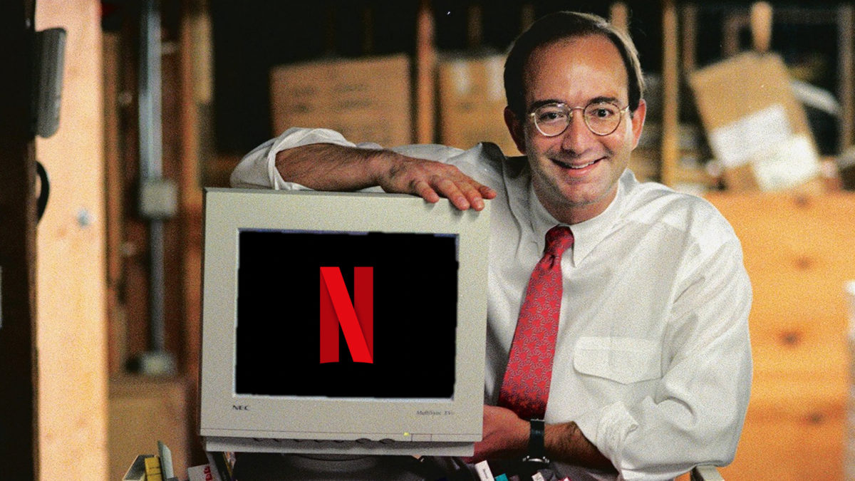 A man standing in front of a computer