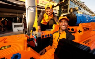 Daniel Ricciardo sits in the LEGO McLaren F1 Car at the Australian Grand Prix in Melbourne.