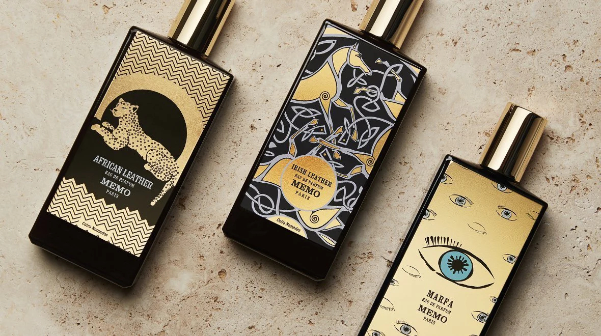A close look at five bottle of men's perfume inspired by travel memories.