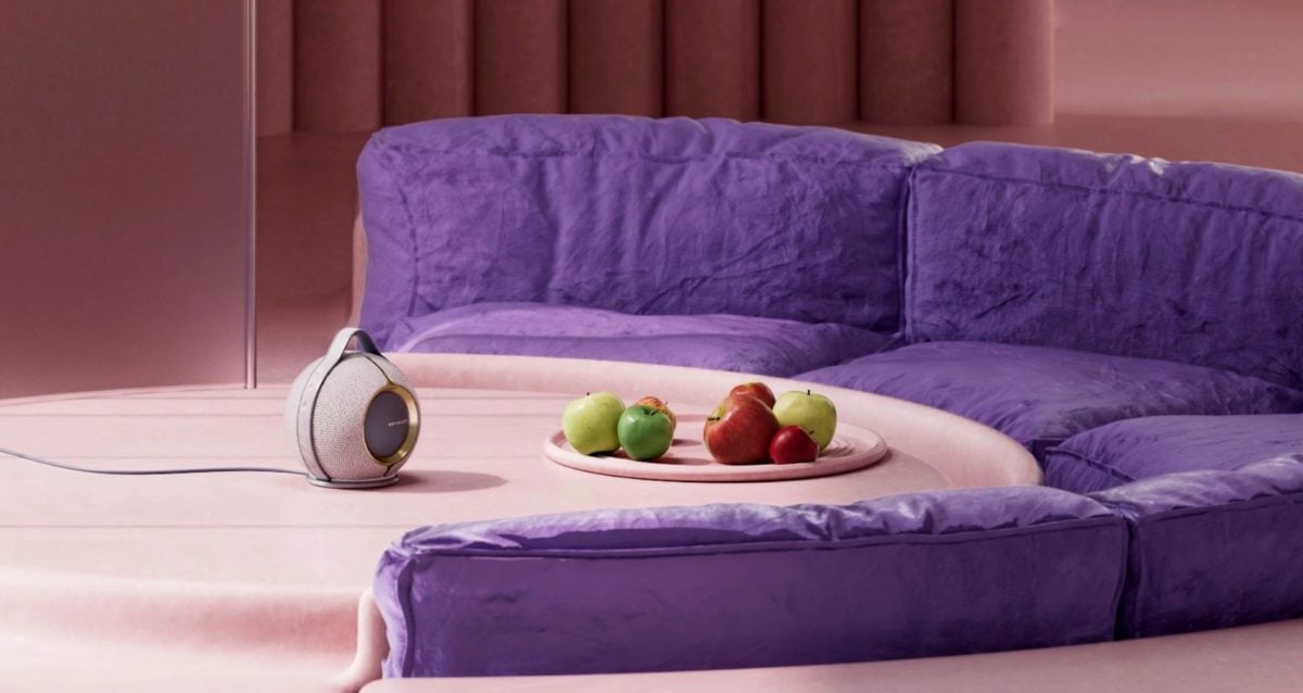 A room that has a blanket on a couch