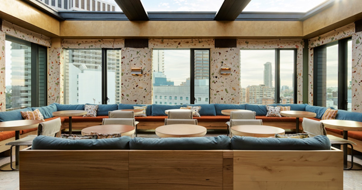 A living room filled with furniture and a large window